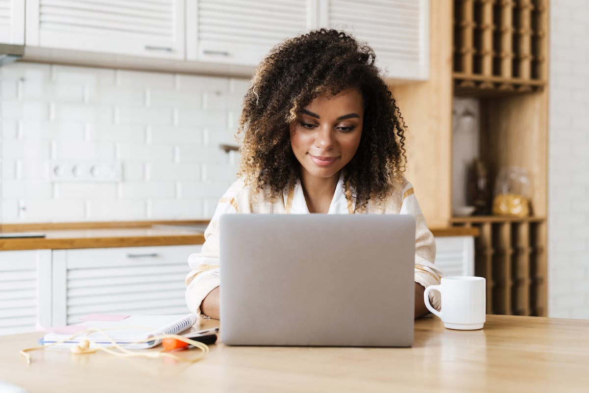 woman conducts research on laptop